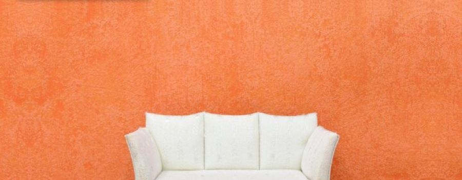 Living room with a white sofa and a heat pump